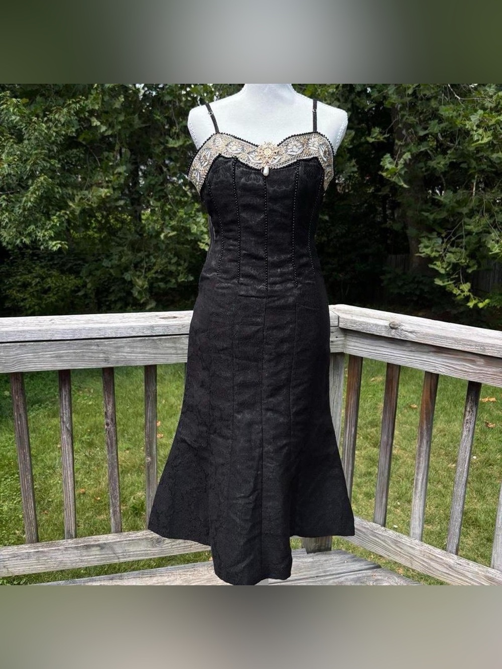 Black and gold embellished dress with pearl pendant